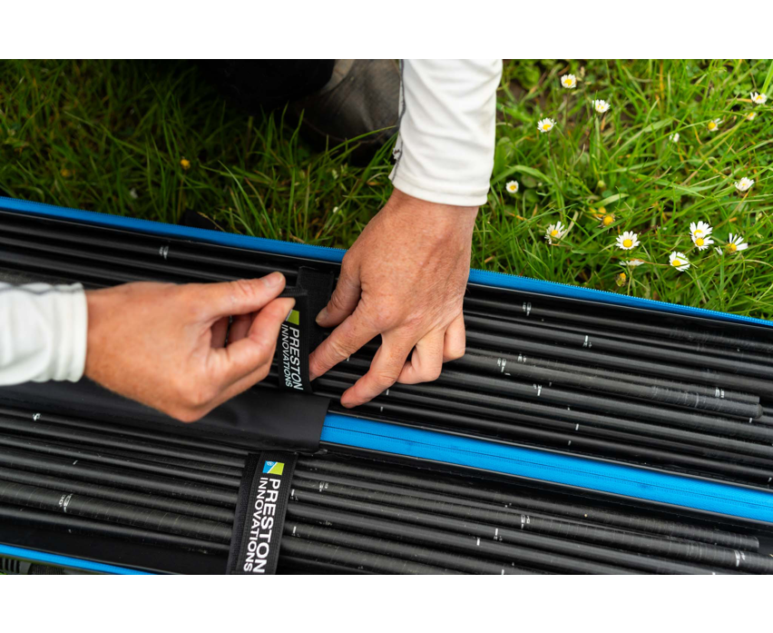 Твърд калъф PRESTON HARDCASE COMPACT KIT SAFE being handled with fishing rods.