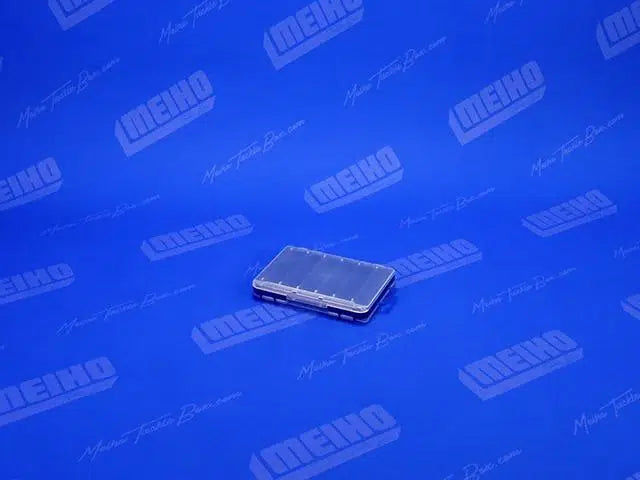 Кутия за примамки MEIHO REVERSIBLE F-86 CLEAR/NAVY на син фон с логото на Meiho.