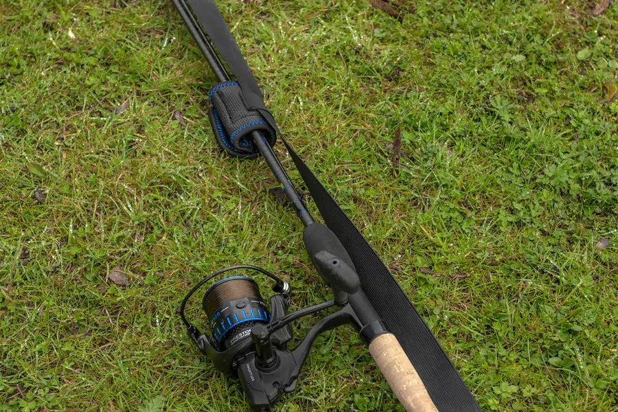 Комплект протектори PRESTON Supera X Tip & Butt Protector on a fishing rod on grass.