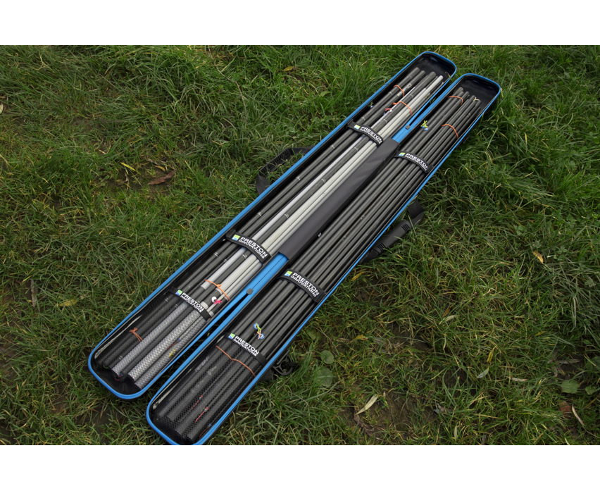 Твърд калъф PRESTON HARDCASE COMPACT KIT SAFE with fishing rods on grass.