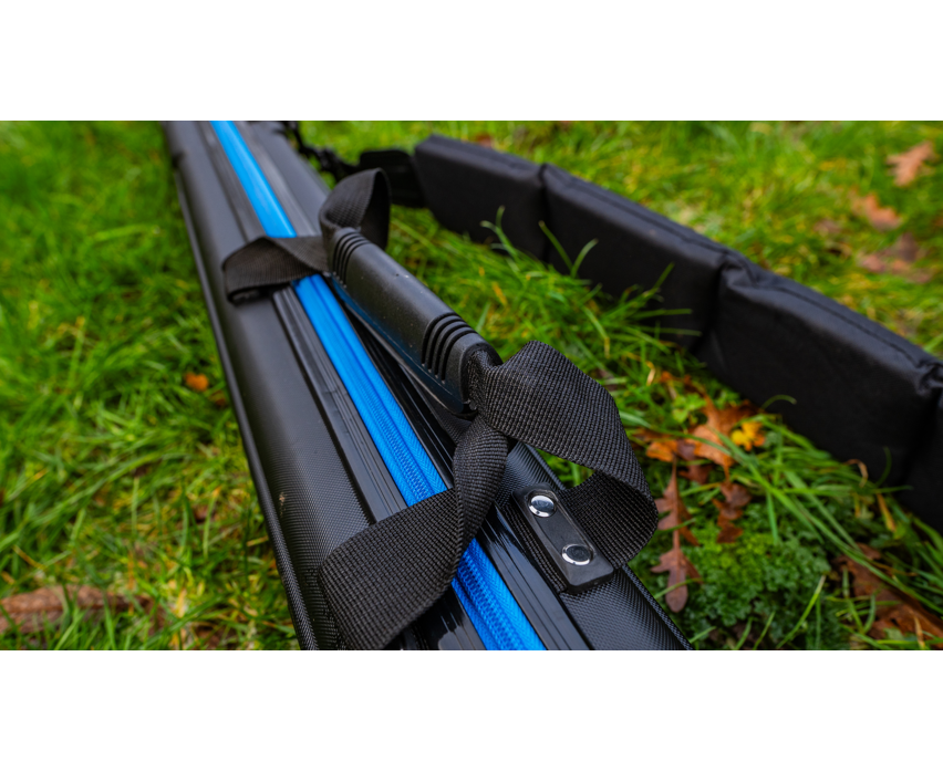 Твърд калъф PRESTON HARDCASE COMPACT KIT SAFE with blue stripes on a grass background.
