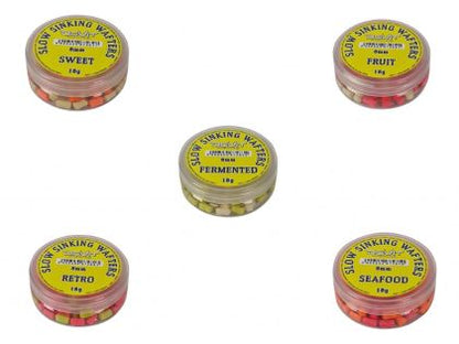 Балансирани дъмбели (Wafters) Dovit SLOW SINKING WAFTERS - 8MM various flavors displayed in containers.