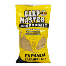 Захранка Van Den Eynde CARP MASTER EXPANDA CARAMEL - 1kg в жълт пакет с изображения на риби.